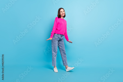 Full length body size photo smiling girl wearing casual clothes isolated pastel pink color background