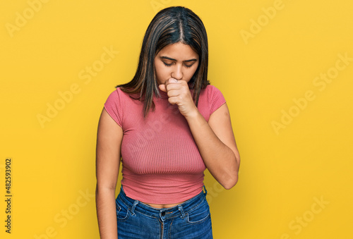 Fotografie, Obraz Young hispanic girl wearing casual t shirt feeling unwell and coughing as symptom for cold or bronchitis