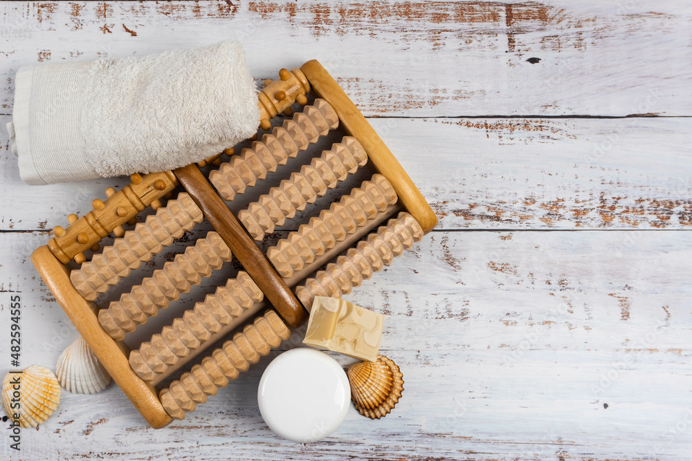 Blank Cream pot and foot massage roller on white background. Copy Space. Blank Cream pot and foot massage roller on white background. Copy Space.