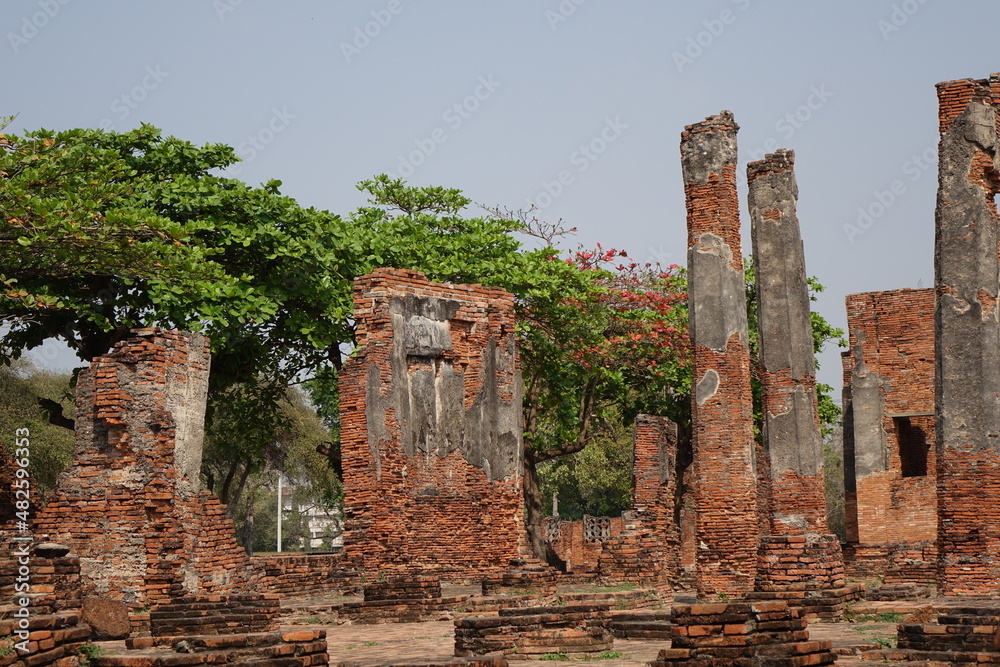 Fototapeta premium Adventure of exploring the ruins of red brick Wat Phra Si Sanphet temple (horizontal image), Ayutthaya, Thailand