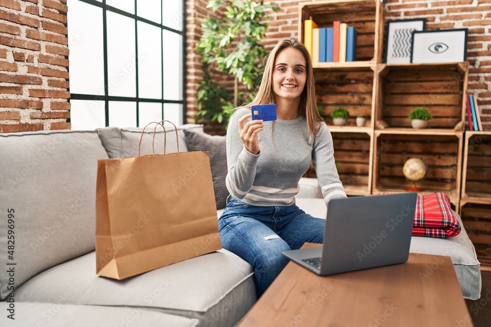 Young blonde woman smiling confident shopping online at home Young blonde woman smiling confident shopping online at home