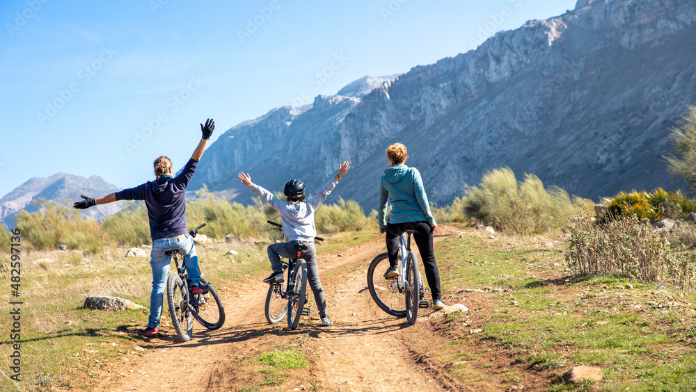 happy family with mountain bike