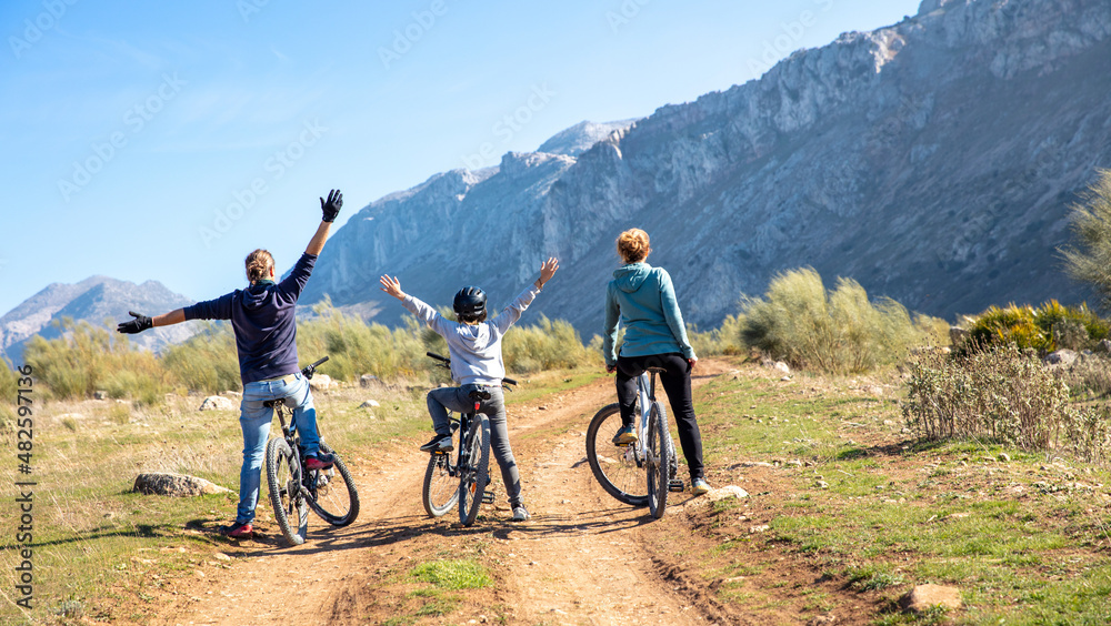 Fototapeta premium happy family with mountain bike