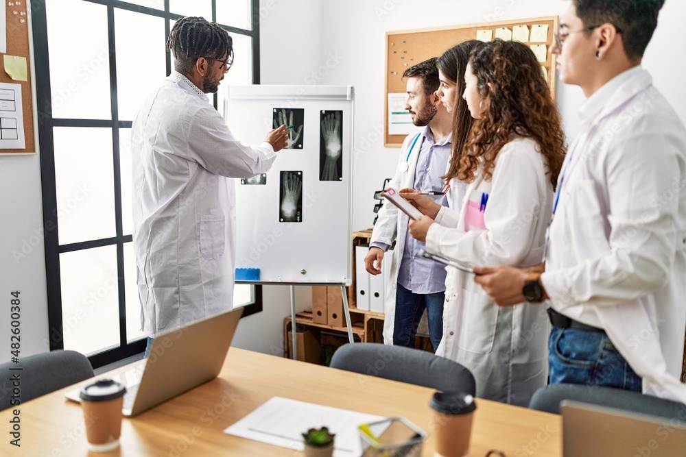 Group of young doctor people discussing in a medical meeting at the clinic office. Group of young doctor people discussing in a medical meeting at the clinic office.