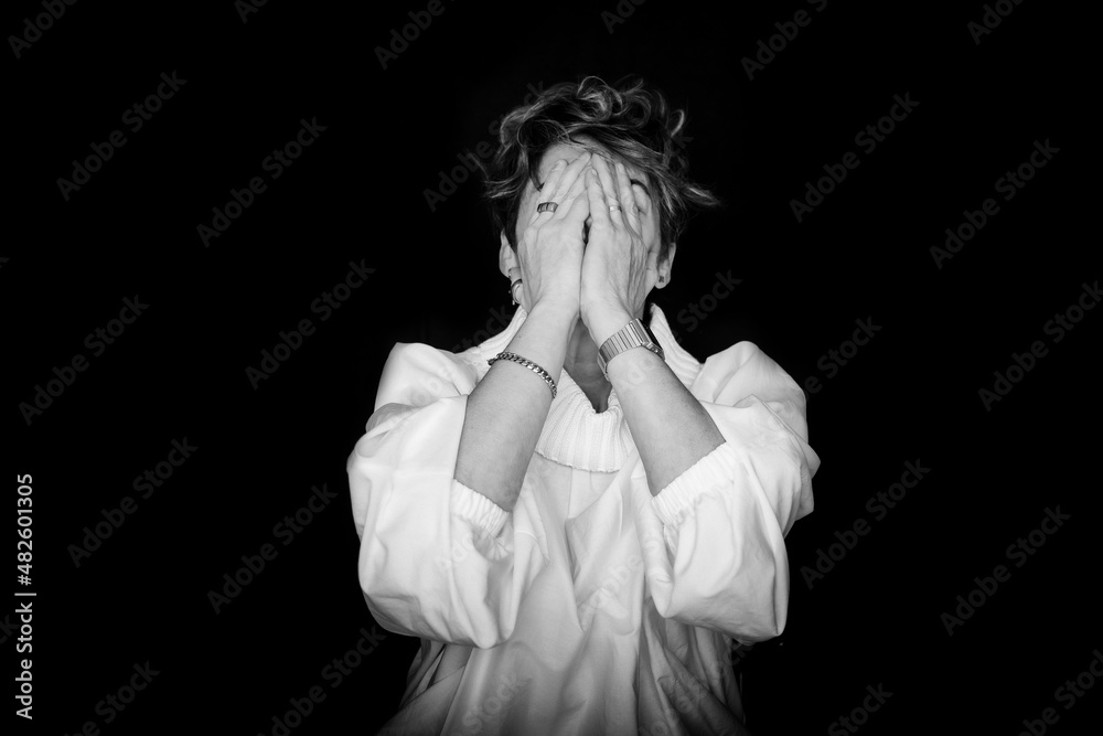Girl Covering Her Face With Her Hands And Laughing Out Loud. 40-Year-Old Woman Posing For International Women's Day, March 8. Warrior Woman. Girl Covering Her Face With Her Hands And Laughing Out Loud. 40-Year-Old Woman Posing For International Women's Day, March 8. Warrior Woman.