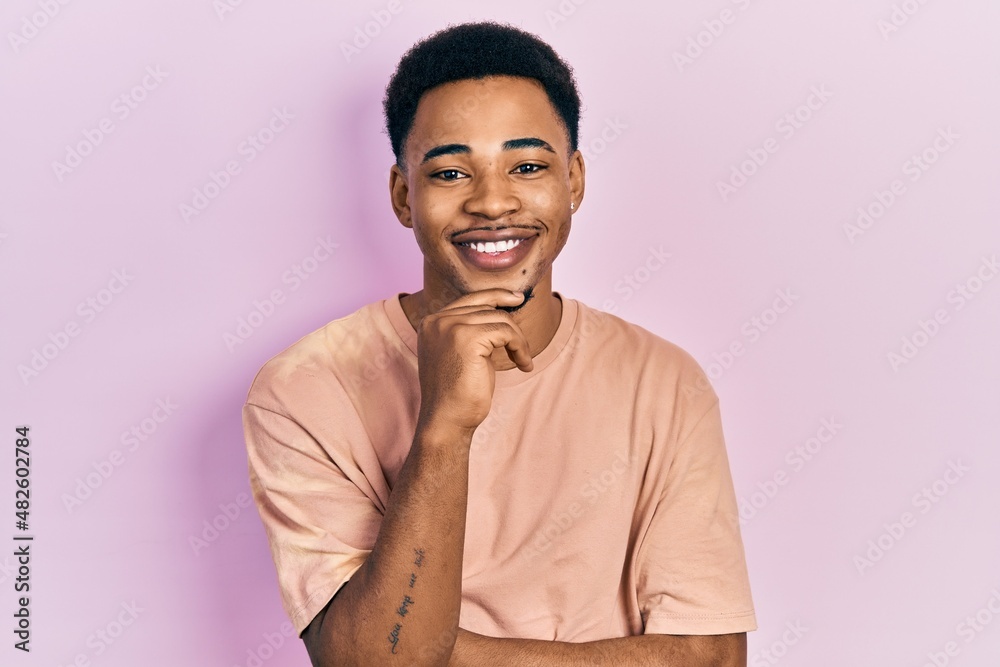 Young african american man wearing casual t shirt annoyed and frustrated shouting with anger, yelling crazy with anger and hand raised
