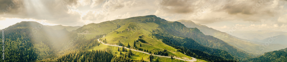 Aerial view of Transbucegi road in Bucegi Mountains from Romania in cloudy summer landscape. Amazing motorways of Romania. Aerial view of Transbucegi road in Bucegi Mountains from Romania in cloudy summer landscape. Amazing motorways of Romania.