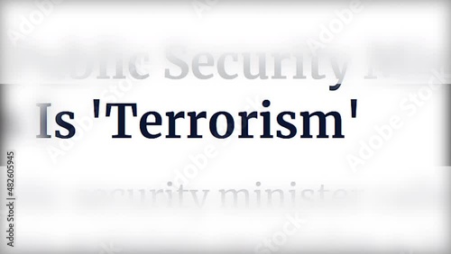 MACRO SHOT: Word terrorism alternating with different fonts on the pages of the media. Concept of urgent hot news about an attack and a crime against humanity. Selected text.
