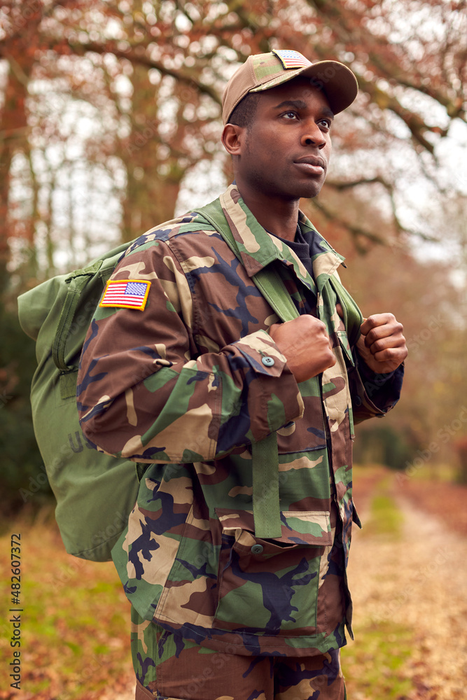 American Soldier In Uniform Carrying Kitbag Returning Home On Leave