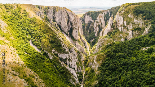 Aerial view over Turda Gorges - Cheile Turzii next to Cluj-Napoca in Romania during a summer day. Amazing mountain landscape.