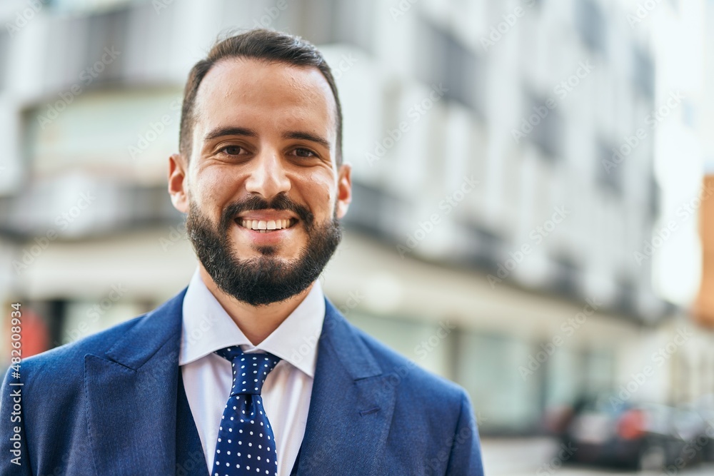 Young businessman smiling happy standing at the city. Young businessman smiling happy standing at the city.