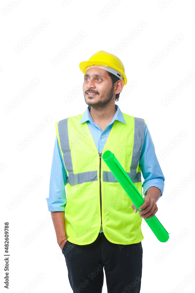 Young architect man with helmet and holding blueprints in hand. on white background. Young architect man with helmet and holding blueprints in hand. on white background.