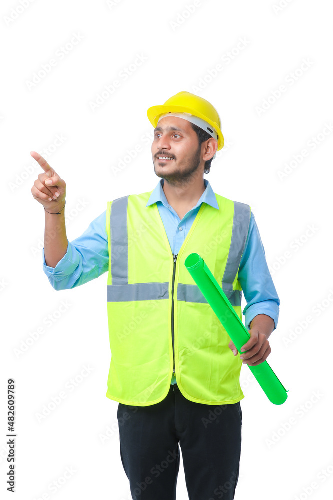 Young architect man with helmet and holding blueprints in hand. on white background. Young architect man with helmet and holding blueprints in hand. on white background.