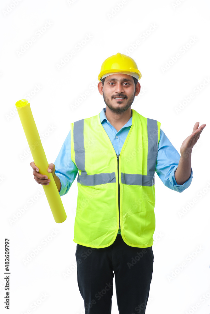 Young architect man with helmet and holding blueprints in hand. on white background. Young architect man with helmet and holding blueprints in hand. on white background.