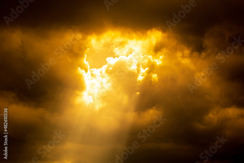 Light of sun from dark clouds like heaven. Sunlight Sunbeam or Sunray through the clouds.