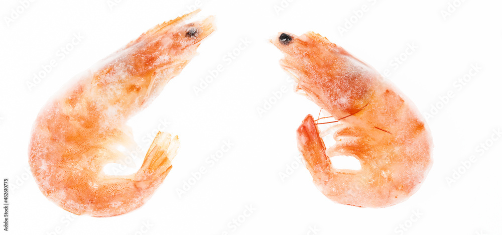 Unpeeled frozen shrimp on a white background. close-up Unpeeled frozen shrimp on a white background. close-up