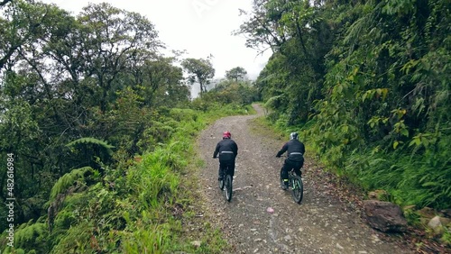 Drone following two bikers riding on the Death road in mounain of Bolivia photo