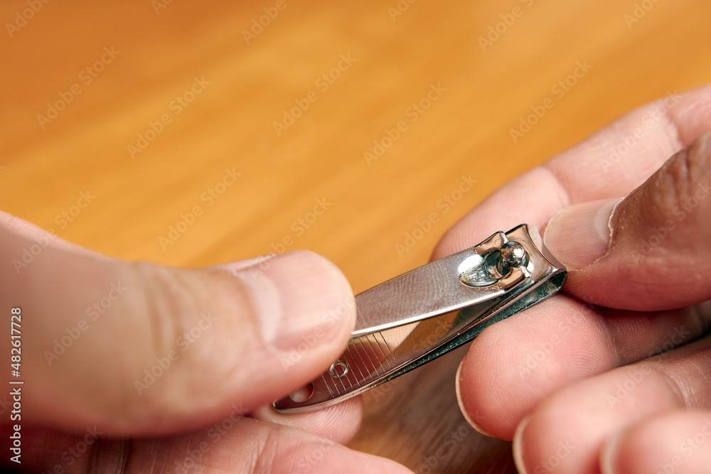 Nippers bite off nails. Hand nail care.