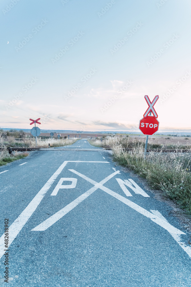 train tracks crossing a road