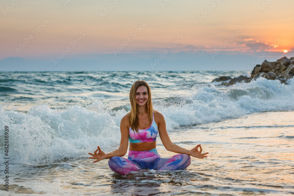 Happy woman practicing yoga