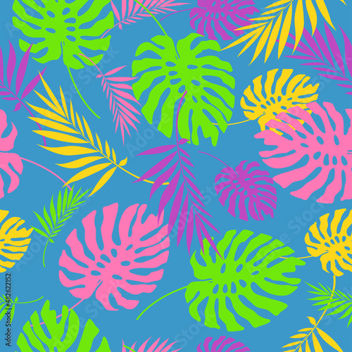 Bright silhouettes of leaves on a blue background. Seamless pattern of tropical or forest leaves, on an isolated brown background.