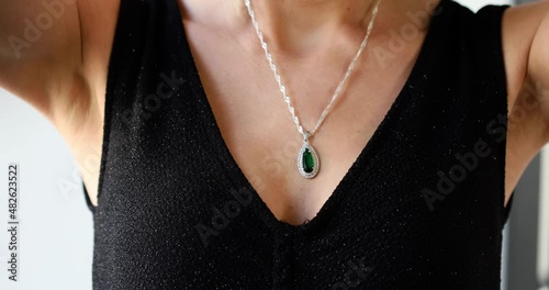 woman wearing jewelry  green stone