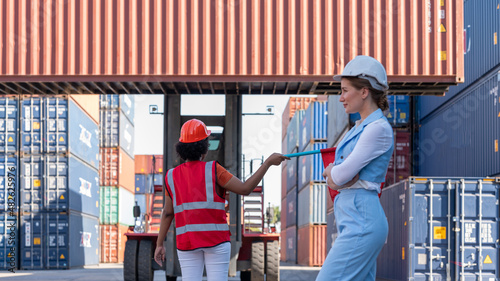 Foreman hold flag and wave the flag to stop forklift when CEO walk pass intront of Forklift