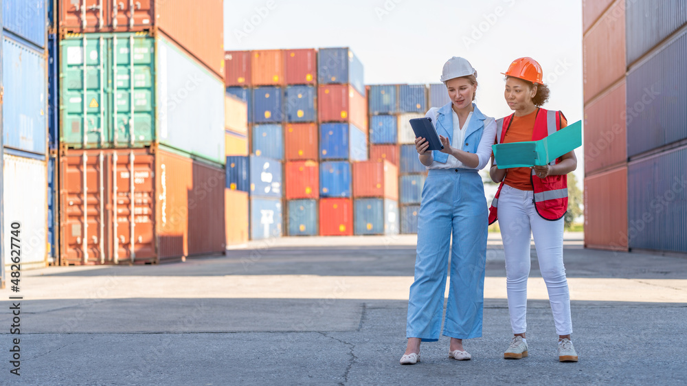 African american holding board file and report business logistic to Woman CEO in cargo container warehouse import and export