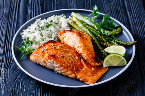 Photography fried salmon fish fillet with rice and asparagus