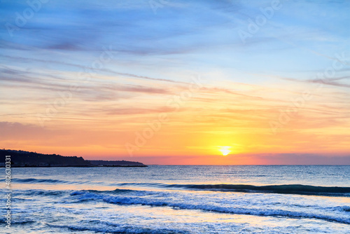 Seaside landscape - the beach with views of the sunrise over the sea  near the city of Varna  on the Black Sea coast of Bulgaria