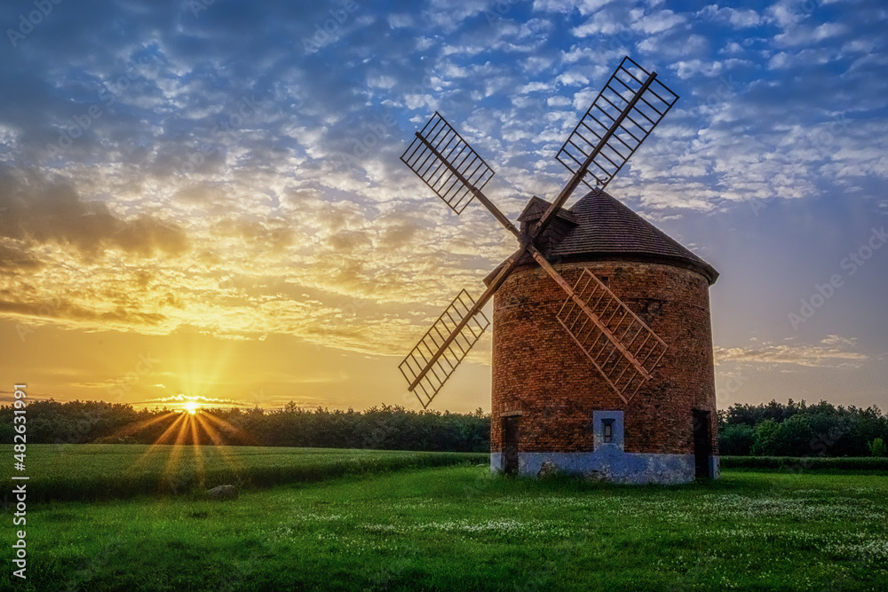 old windmill at sunrise in the Moravian village of Chvalkovice