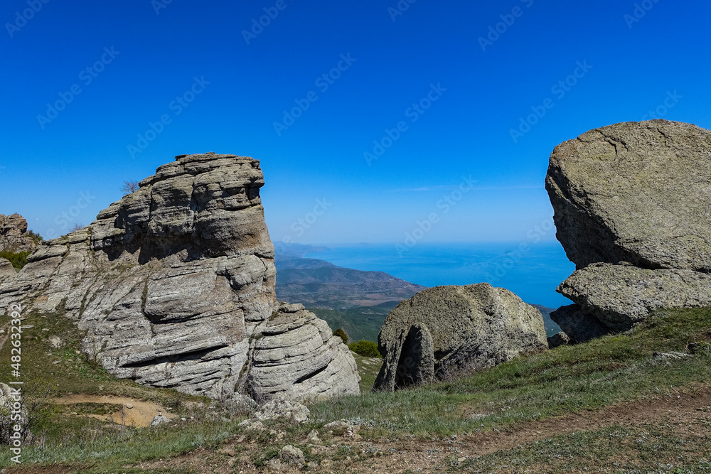 The Valley of Ghosts. Demerji. Green trees and bushes in the foreground. Crimea.