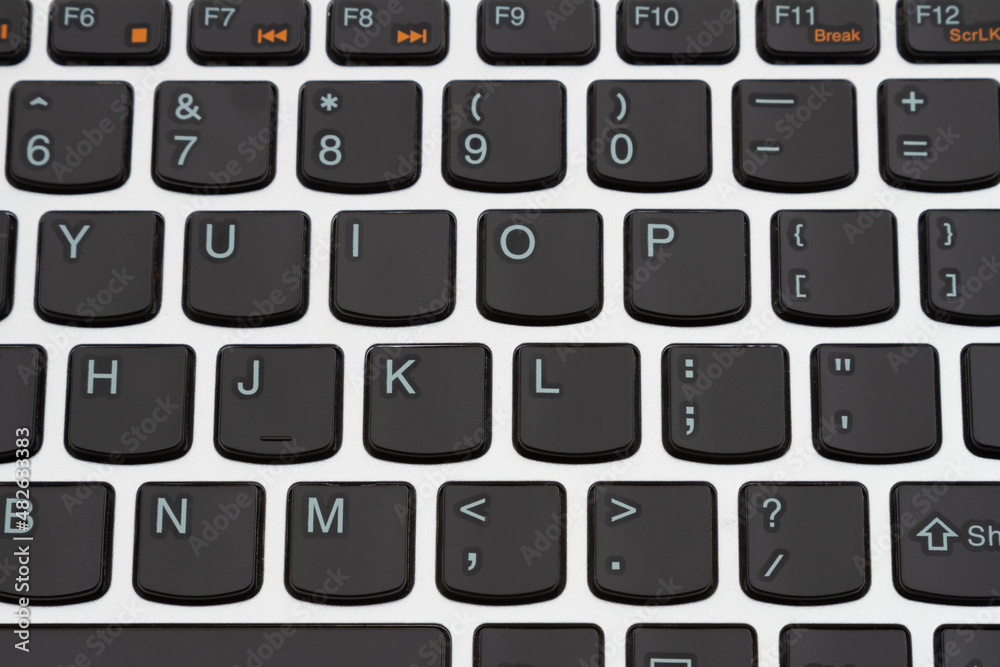 Black and silver low profile keyboard close up Black and silver low profile keyboard close up