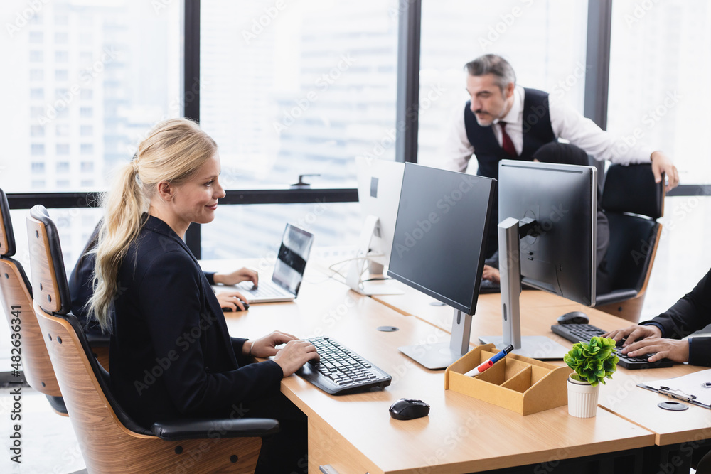 Young businesswoman sitting at the office table. Young businesswoman sitting at the office table.