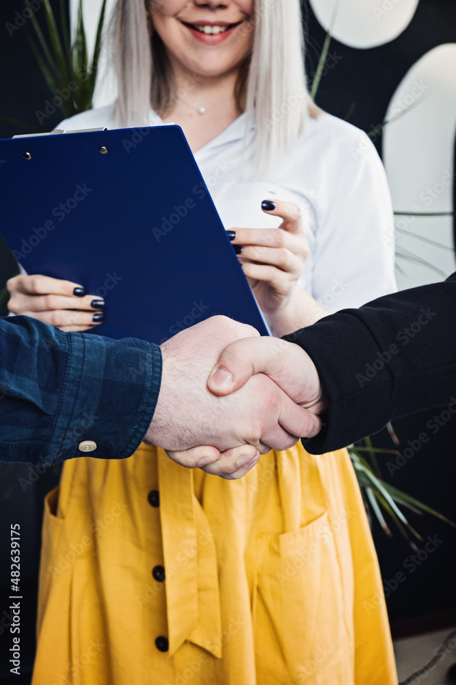 Businessmen People in informal casual clothes shaking hands. Client or customer and business owner agreement, business partner, Cooperation concept. Businessmen People in informal casual clothes shaking hands. Client or customer and business owner agreement, business partner, Cooperation concept.