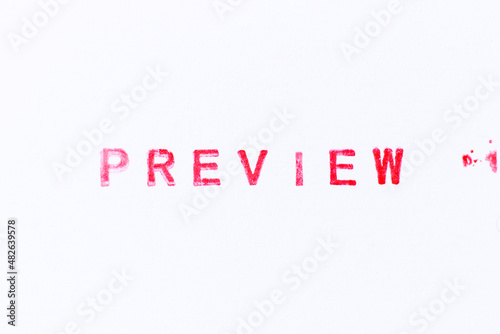 Red color ink rubber stamp in word preview on white paper background