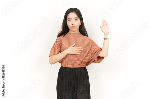 Slika na platnu Swearing or Promise Gesture Of Beautiful Asian Woman Isolated On White Backgroun