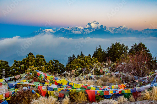 prayer flags with mountains in background photo