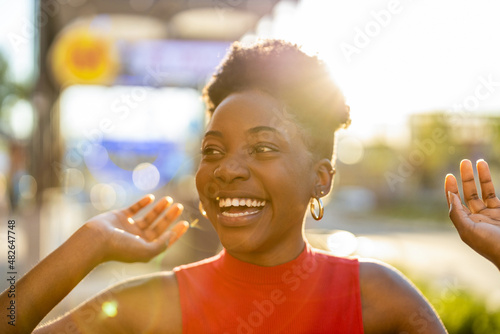 Portrait of happy young woman outdoors 