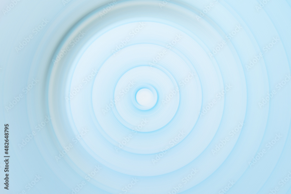 Circular rippled light blue water surface Circular rippled light blue water surface