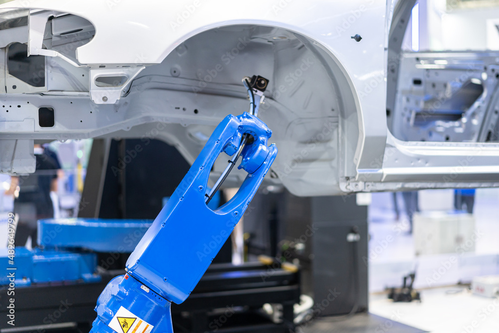 robot arm working in factory robot arm working in factory