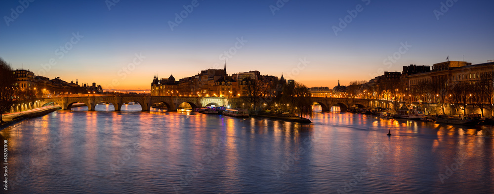 Sunrise in the heart of Paris with Ile de la Cite and Pont Neuf. The Seine River banks are a Unesco World Heritage site. France