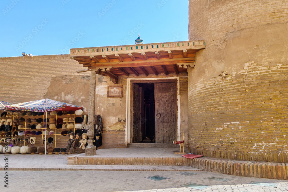 Entrance to Juma Mosque, one of most ancient mosques in Khiva, Uzbekistan. On the left is lower part of the minaret. Building founded in 10th century Entrance to Juma Mosque, one of most ancient mosques in Khiva, Uzbekistan. On the left is lower part of the minaret. Building founded in 10th century