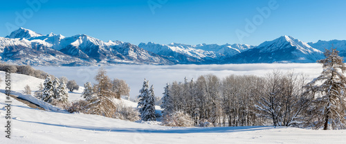 Winter view of the Champsaur Valley with Ecrins National Park mountain peaks in the distance. Hautes-Alpes (Gleize Pass, French Alps). France