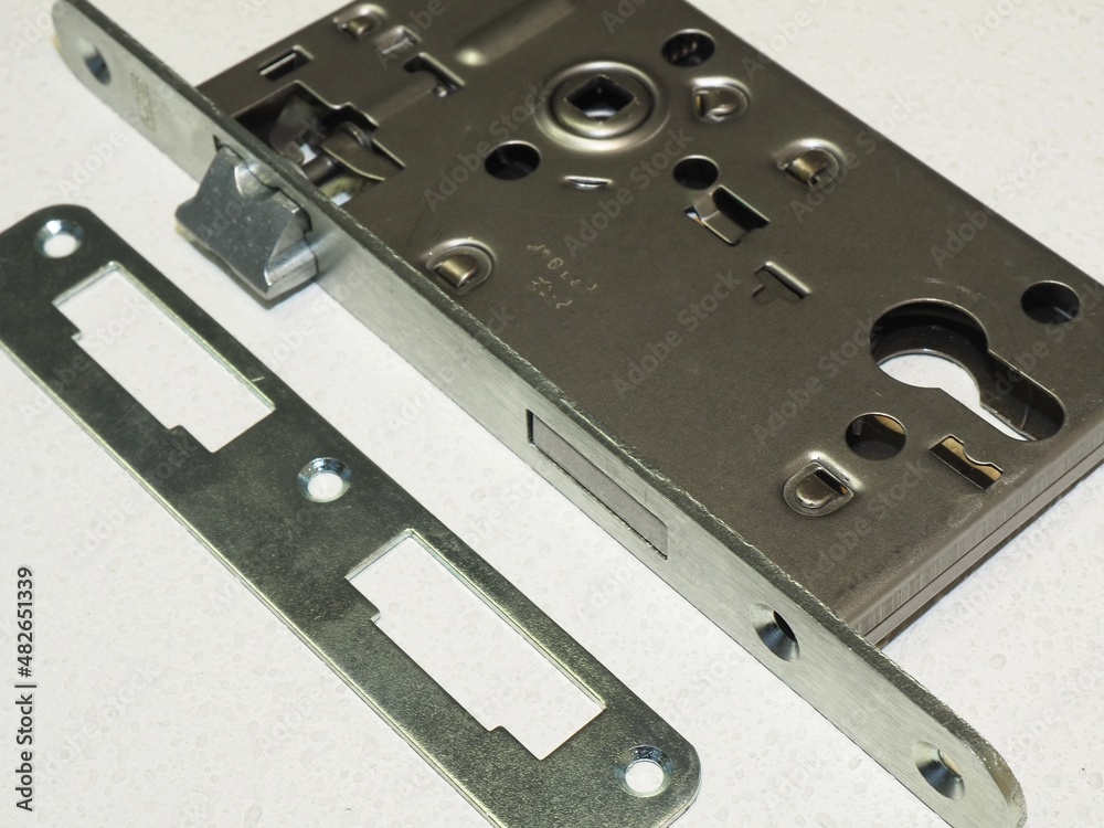 New door lock mechanism. Door lock replacement. Broken door lock. Conventional mortise lock for door New door lock mechanism. Door lock replacement. Broken door lock. Conventional mortise lock for door