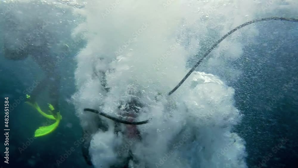 Scuba Diver Jumps From a Dive Boat Slow Motion. High speed Camera Shot. In Slow Motion A Scuba