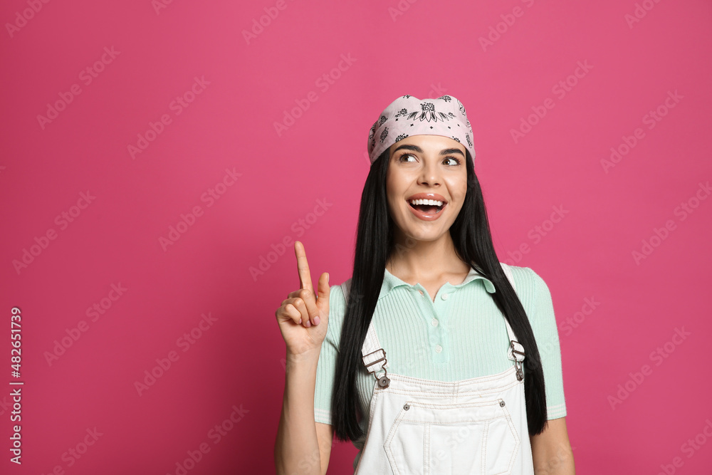 Young woman wearing stylish bandana on pink background, space for text Young woman wearing stylish bandana on pink background, space for text