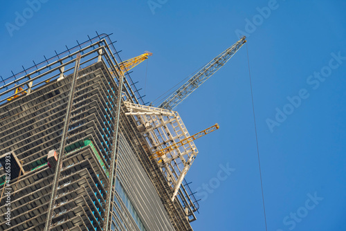 Construction work site on blue sky background