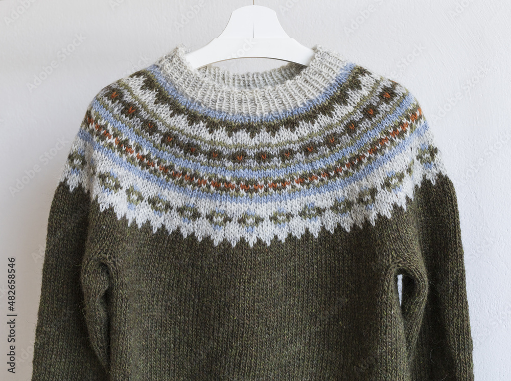 Brown and grey Icelandic wool knitted lopapeysa sweater in traditional  nordic pattern, close up yoke view Stock Photo | Adobe Stock