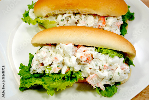 Two Seafood Salad Sandwiches Served on a White Plate photo